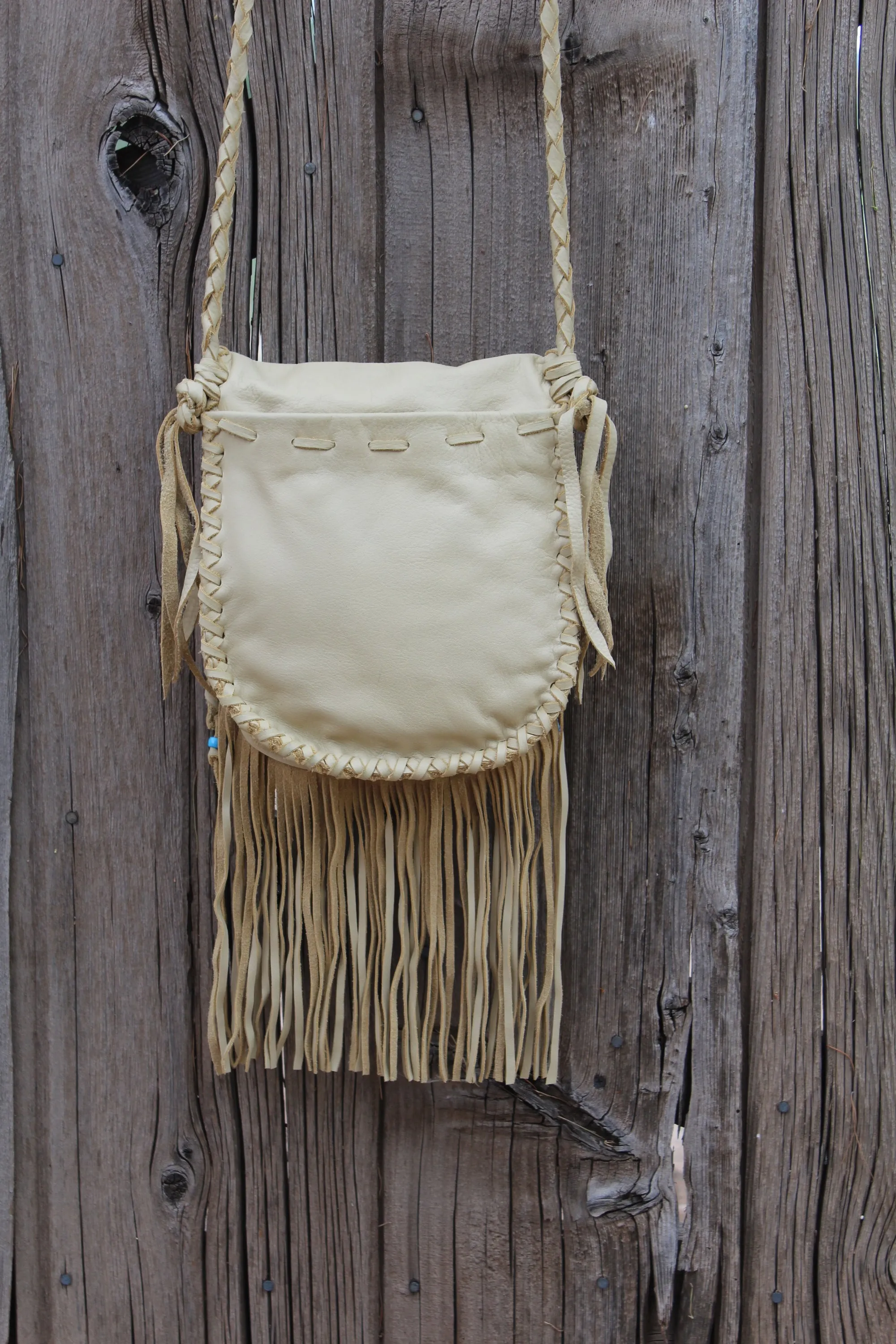 Fringed leather handbag, handstitched leather purse